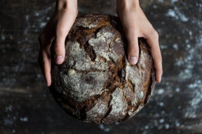 Human Holding a Bread