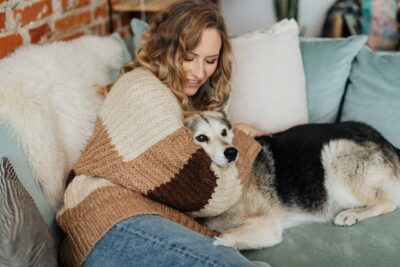 Woman hugging her dog