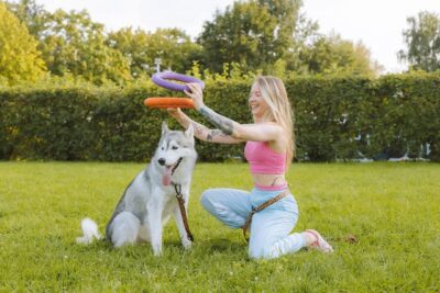 Woman playing with her dog